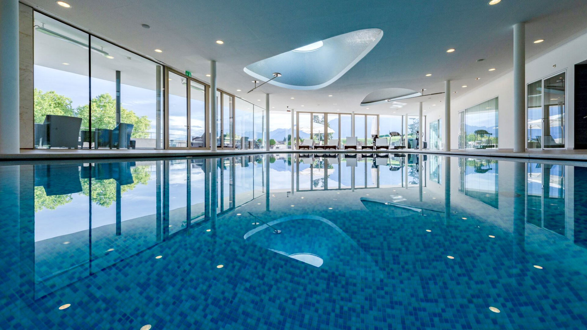 Indoor pool at Clinique La Prairie with lake views